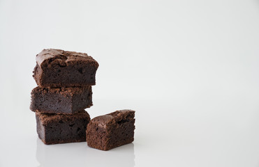 Pile of brownies on white background