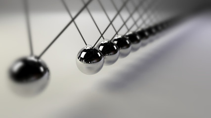 cause and effect concept, infinity steel Newton's cradle on a white background (3d illustration with dof)