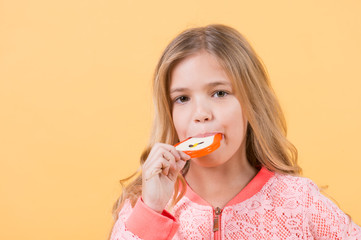 Child eat candy on stick, food