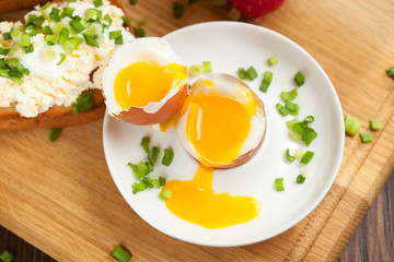 Boiled egg with crunchy bread and healthy vegetables for breakfast