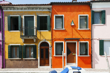 Orange and yellow house in Burano, a little island in Venetian lagoon, Italy