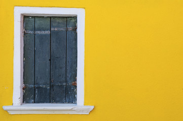 Yellow wall and wooden window, Burano island, Venice