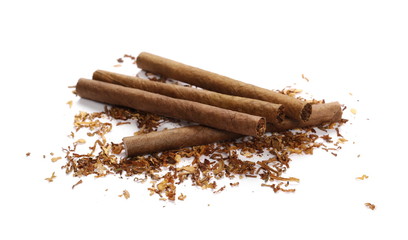 Cigarillos and tobacco pile isolated over white background