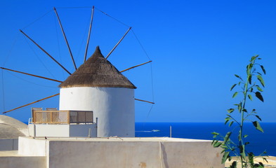 Fototapeta na wymiar White Windmill in Santorini, Greece
