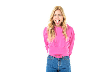 Blonde woman holding pill on her tongue isolated on white