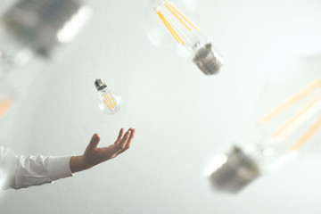 hand takes light bulbs on the fly