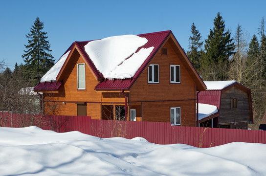 New wooden summer cottage in winter