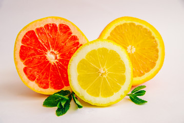 Fototapeta na wymiar Grapefruit, lemon and orange on a white background.