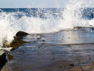 Wave crushing on breakwater