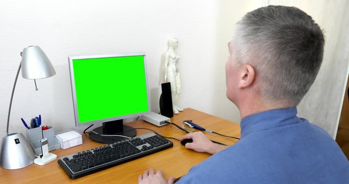 the doctor works at a computer with a green screen and searches the Internet for information. The doctor's office and chromakey