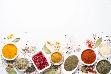 Various spices in a bowls on white. © nadianb