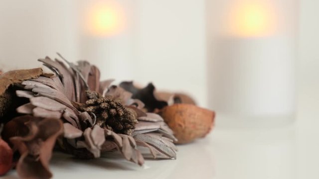 Zen background with light from LED candles shallow DOF footage - Fragrant petals and spices of potpourri mixture
