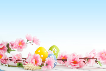 Spring flowers and colorful easter eggs