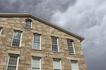 Old stone clock tower historic mill building