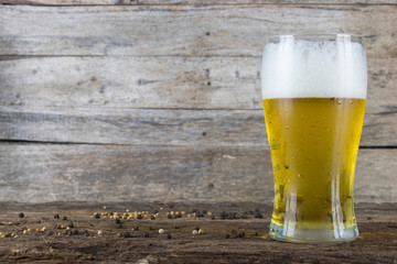 cold beer on the table wood background