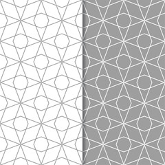 Gray and white geometric ornaments. Set of seamless patterns