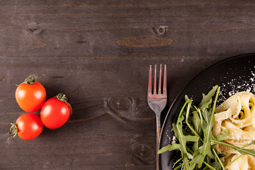 Top view of delicious pasta on wooden table