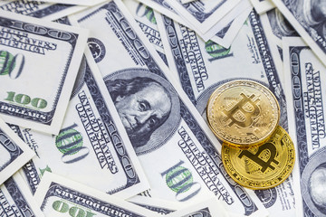 Fototapeta premium Bitcoins on dollars.