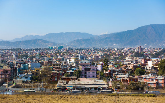 Part of Kathmandu city as seen from a vantage point, Nepal. Hills and mountains in the background.