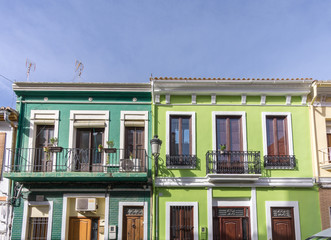 Typical neighborhood, traditional, vintage apartment architecture, colorful facade of a residential building