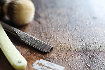 Shaving accessories on a wooden background 