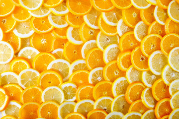 Abstract background of sliced orange and lemon. Top view.