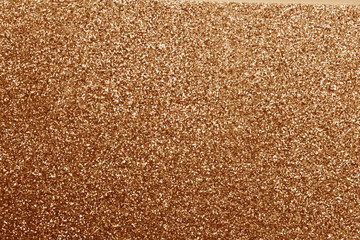 Glittering background in brown tone.