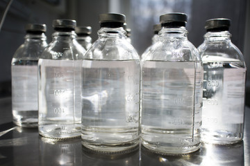 bottles with solutions on the medical table
