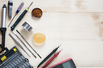Repairman workplace withspecial tools. Tool kit: multimeter, magnifying glass, soldering iron,...