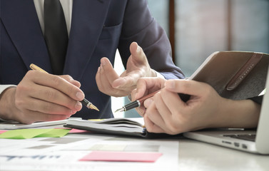 Business concepts,Management is executing the secretary is taking notes.