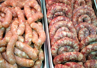 The sausage is handmade in the shop window.