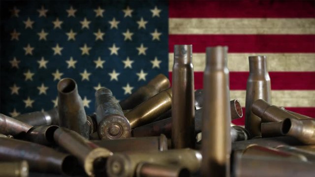 ammunition placed in front of a american flag
