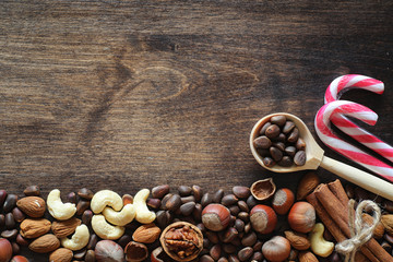 Different nuts on a wooden table. Cedar, cashew, hazelnut, walnu
