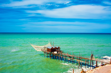 A traditional fishing machine of the city of Termoli, known as ancient Trabucco,very famous and visited by tourists, located on the Gargano Coast, Apulia's national park in Italy. Seascape 