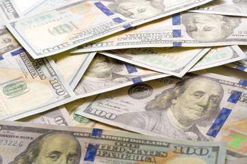 Dollar banknotes background. American paper dollar bills as part of the global financial and trading system.