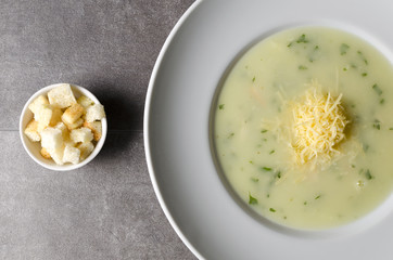 Cheese chicken soup with croutons in a white plate