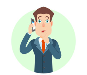 Businessman talking on mobile phone and standing with his finger to his lips