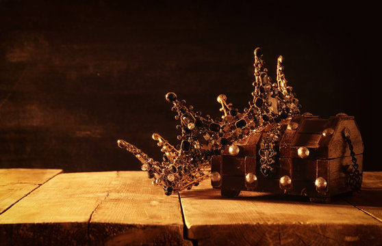 low key image of beautiful queen/king crown. fantasy medieval period. Selective focus.