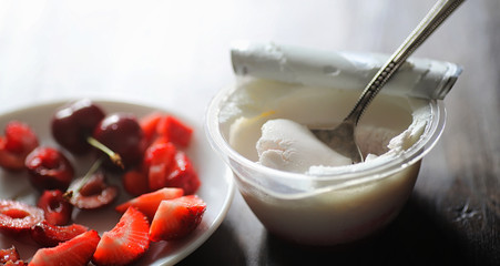 Fresh yogurt with berries. Ice cream in a bowl with fresh and ju