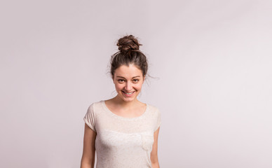 Portrait of a young beautiful woman in studio.