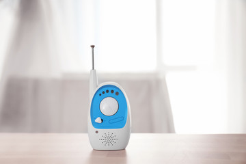Baby monitor on table in room. Radio nanny