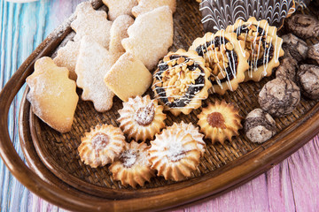 Tasty different cakes set on a color gradient background