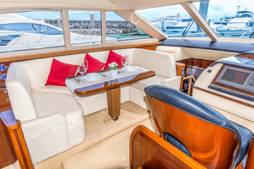 Luxury lunch table setting on a yacht interior comfortable design for holiday recreation tourism travel and vacation concept