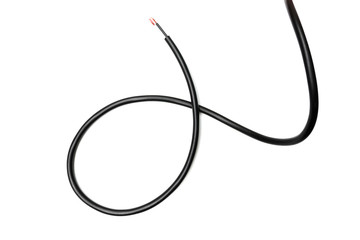 Black wire cable isolated on a white background abstraction.