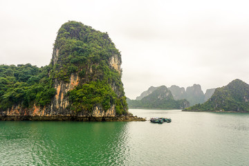 Fototapeta na wymiar Limestone cliff formations in Halong Bay, Vietnam