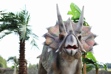 Park of dinosaurs. A dinosaur on the background of nature. Toy d