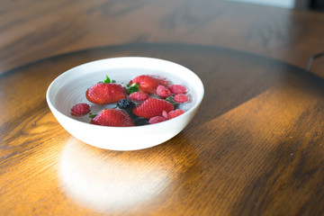 Strawberries, Blackberries and raspberries  in a bowl of water 