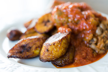 Nigerian Brown Bean Porridge (Ewa Agoyin) with fried Plantain  