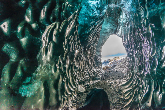 Ice tunnel between valley near glacier in Iceland. Destination landmark of travel in winter season.