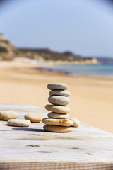 Zen stones on a sand beach